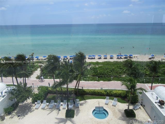 6365 Collins Avenue, Unit 1008 Miami Beach, FL 33141 - Photo 1 of 49 a view of a lake