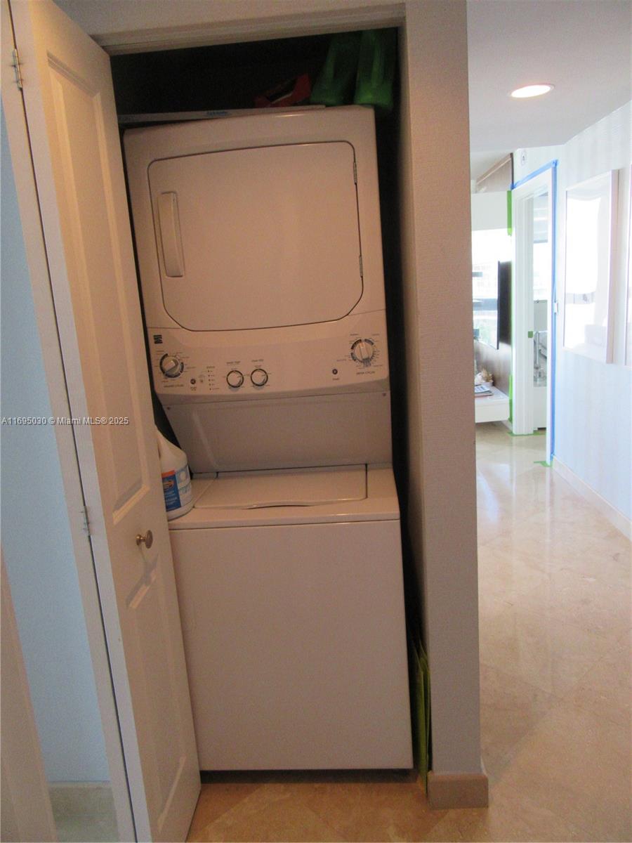 6365 Collins Avenue, Unit 1008 Miami Beach, FL 33141 - Photo 29 of 49 a utility room with dryer and washer