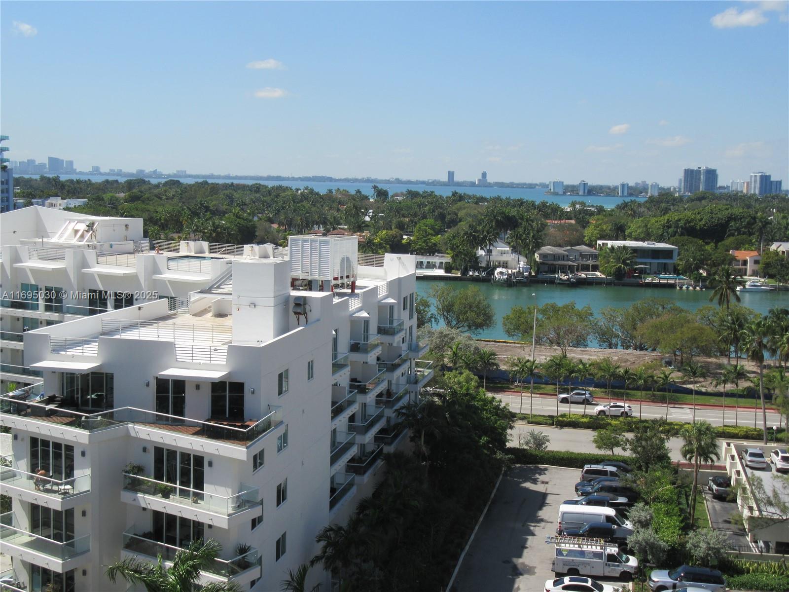 6365 Collins Avenue, Unit 1008 Miami Beach, FL 33141 - Photo 30 of 49 a view of a lake with a city