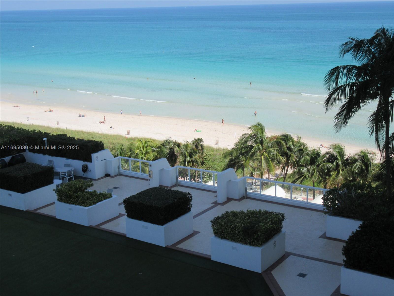 6365 Collins Avenue, Unit 1008 Miami Beach, FL 33141 - Photo 33 of 49 a view of yard from deck with patio