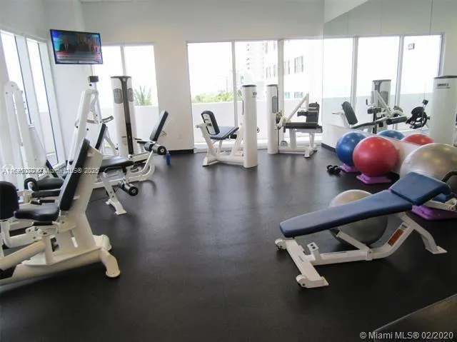 a view of a swimming pool with outdoor seating