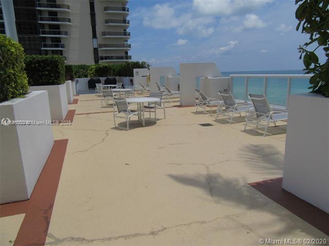 6365 Collins Avenue, Unit 1008 Miami Beach, FL 33141 - Photo 38 of 49 a view of a swimming pool with outdoor seating