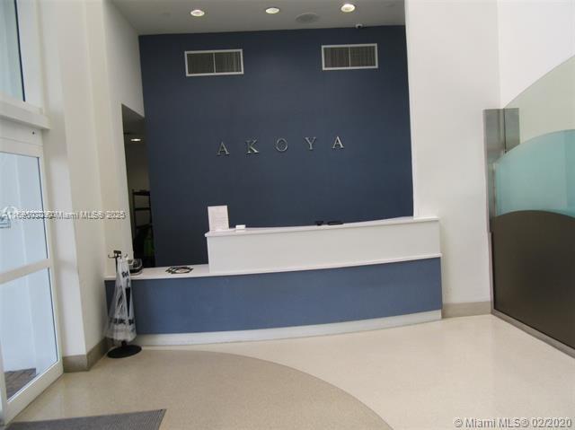 6365 Collins Avenue, Unit 1008 Miami Beach, FL 33141 - Photo 41 of 49 a view of an empty room with wooden cabinet