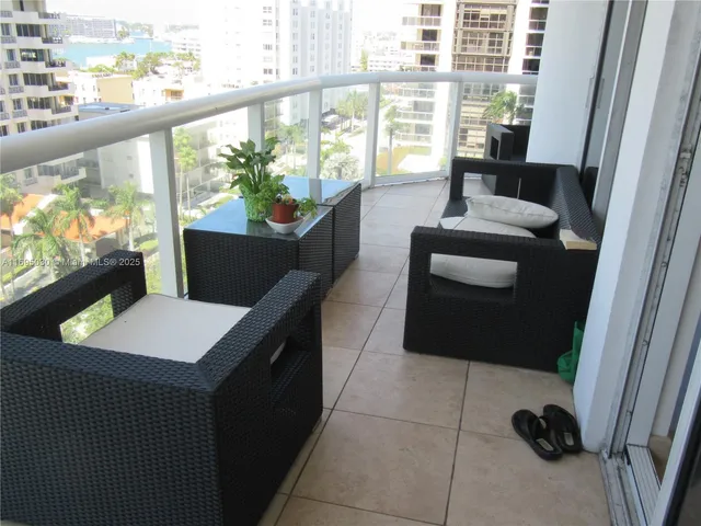 a view of a balcony and chairs