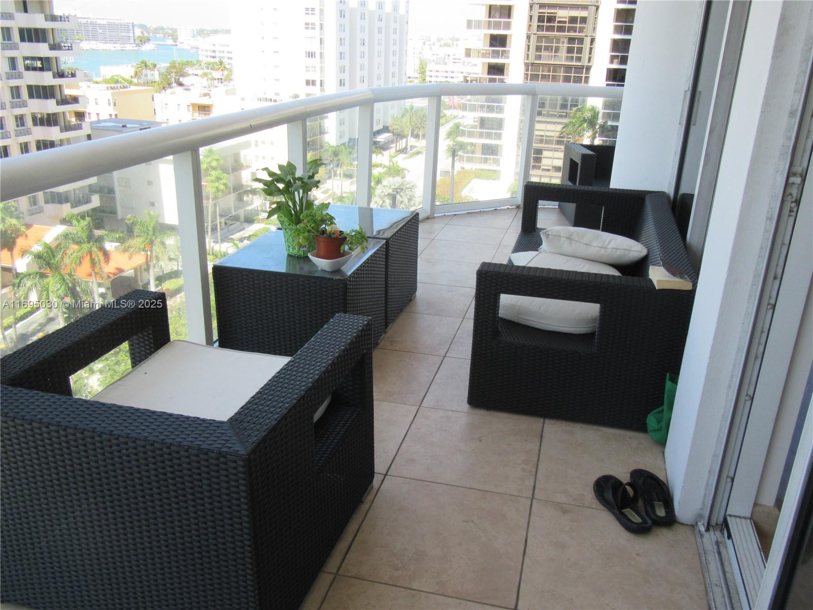 6365 Collins Avenue, Unit 1008 Miami Beach, FL 33141 - Photo 6 of 49 a living room with large window and furniture