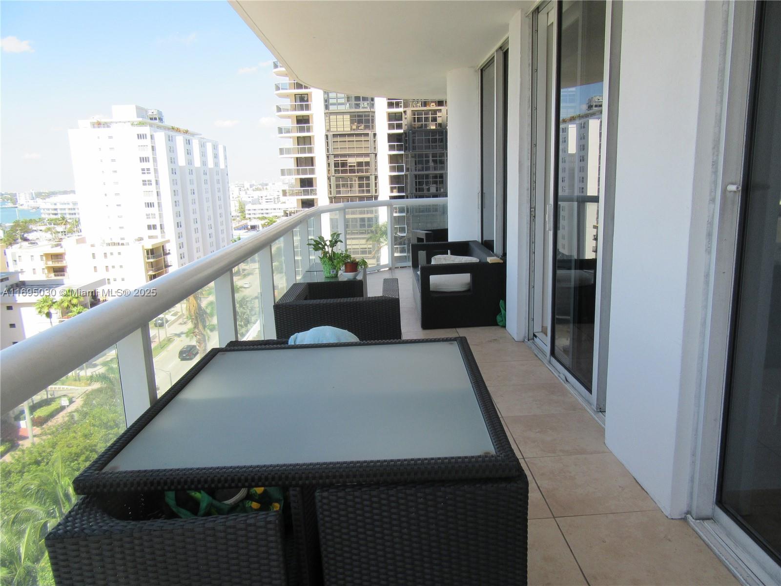 6365 Collins Avenue, Unit 1008 Miami Beach, FL 33141 - Photo 7 of 49 a view of a balcony and chairs