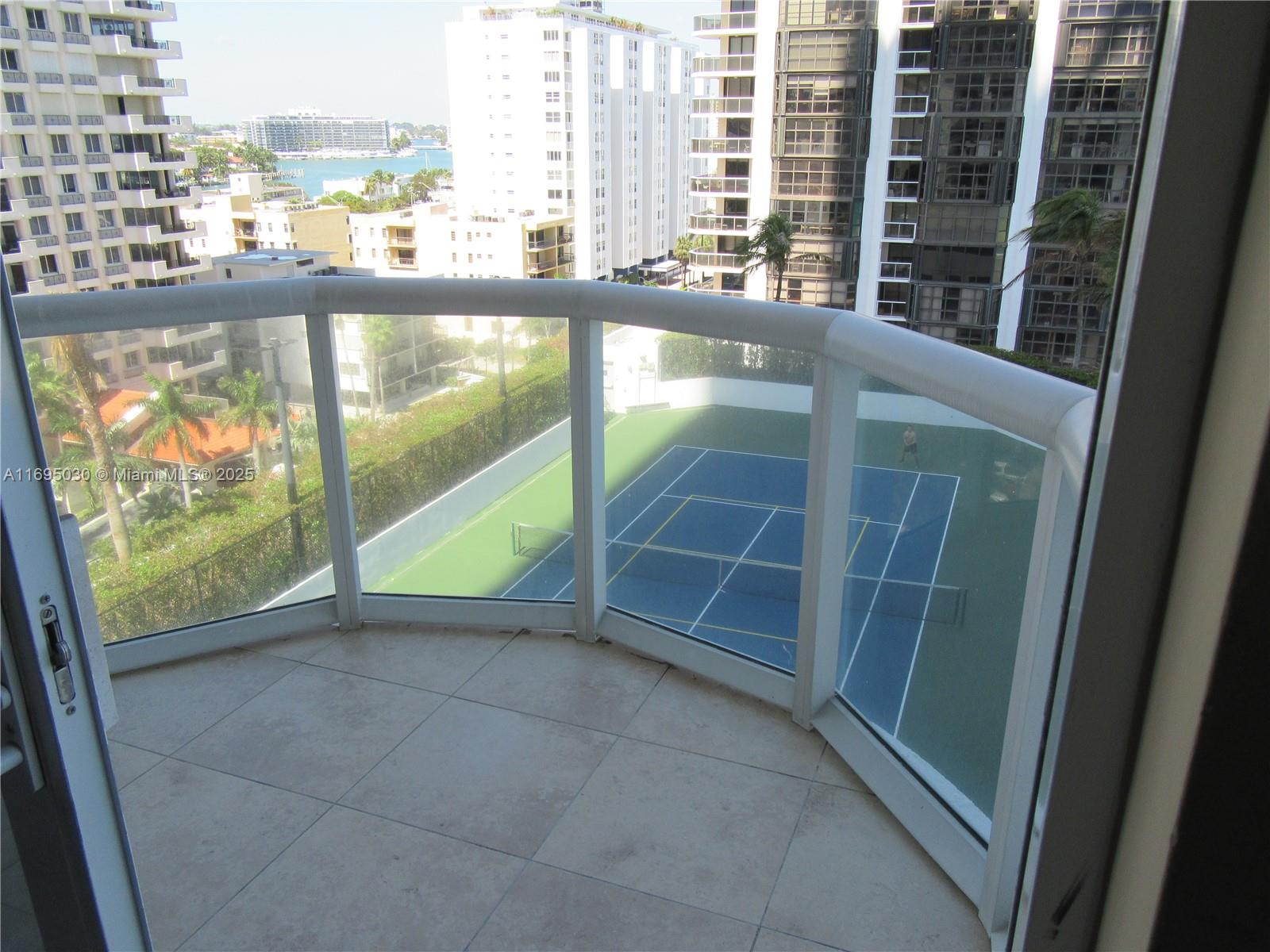 6365 Collins Avenue, Unit 1008 Miami Beach, FL 33141 - Photo 8 of 49 a view of an empty room with a window