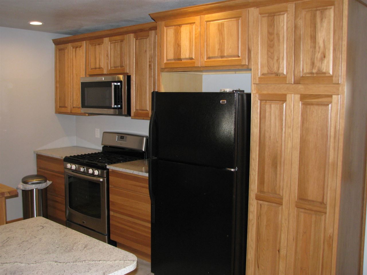 1152 Middle Road South Beloit, IL 61080 - Photo 16 of 24 a kitchen with stainless steel appliances granite countertop a refrigerator a stove a sink and dishwasher with wooden floor