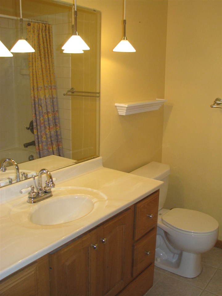 1152 Middle Road South Beloit, IL 61080 - Photo 5 of 24 a bathroom with a sink a toilet and shower