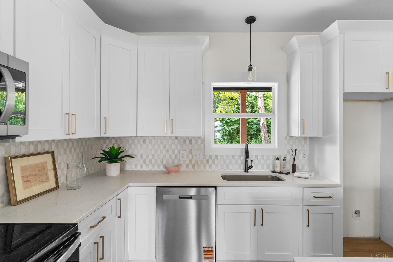 6 Wirtz Road Wirtz, VA 24184 - Photo 17 of 56 a kitchen with stainless steel appliances white cabinets a sink a window and potted plant