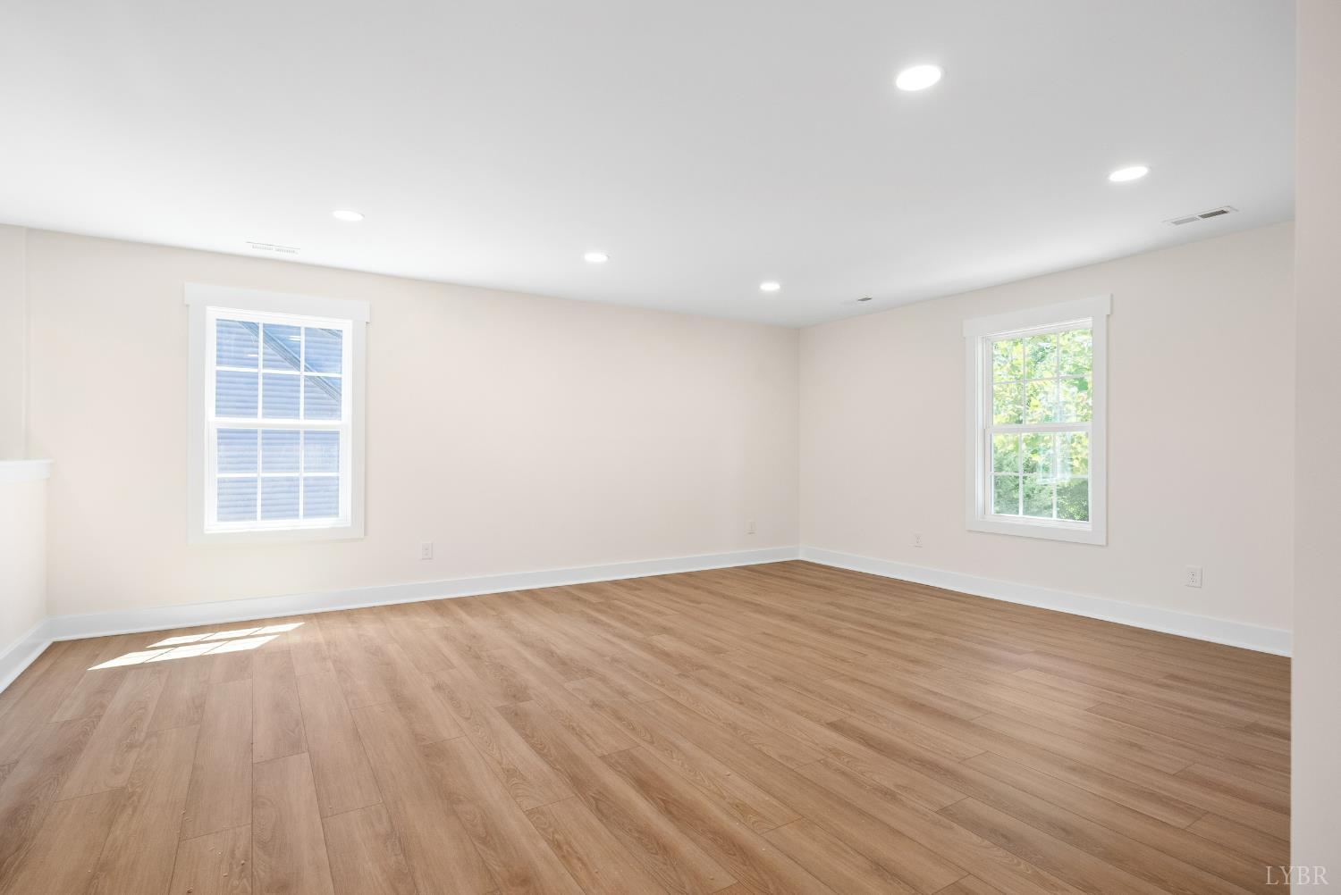 6 Wirtz Road Wirtz, VA 24184 - Photo 29 of 56 an empty room with wooden floor and windows