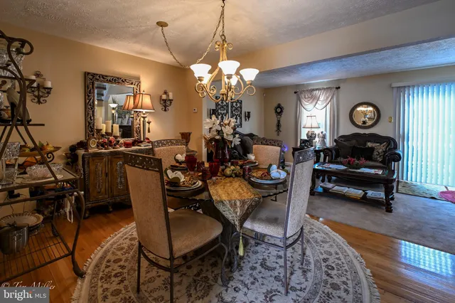 a living room with furniture a clock and a window