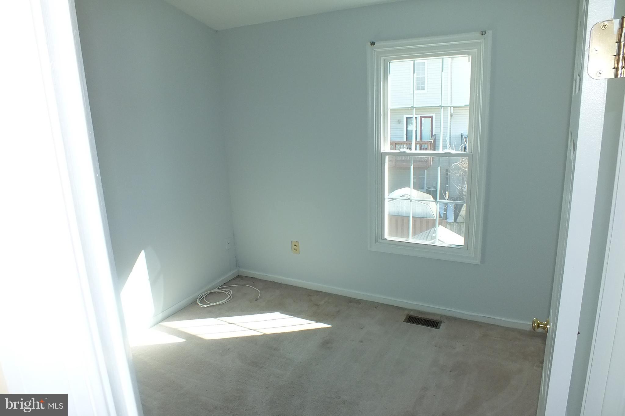 21 Cedarcone Court Nottingham, MD 21236 - Photo 17 of 38 an empty room with a window