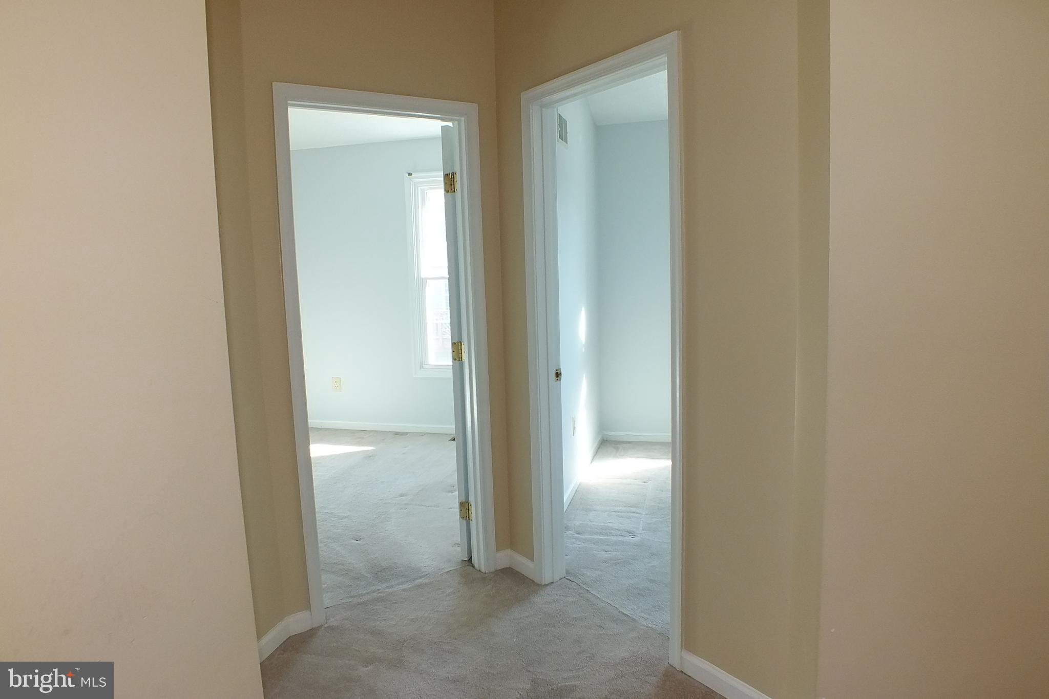 21 Cedarcone Court Nottingham, MD 21236 - Photo 19 of 38 a view of a bathroom from a corridor