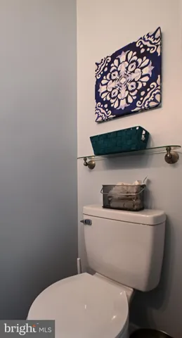 a bathroom with a toilet and a sink