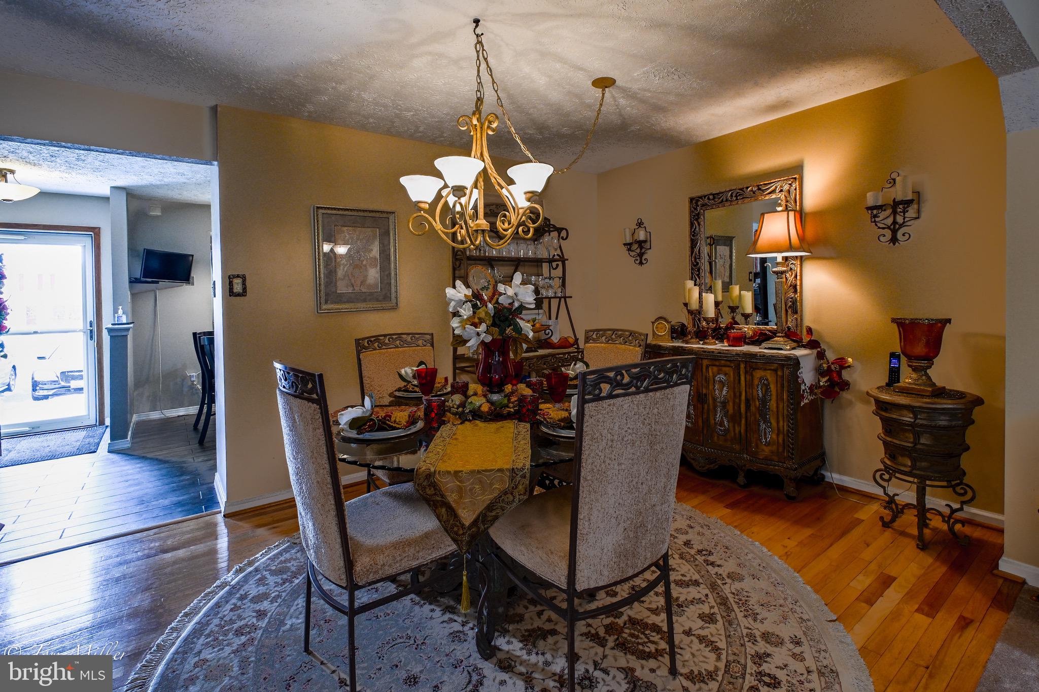21 Cedarcone Court Nottingham, MD 21236 - Photo 21 of 38 a view of a dining room with furniture and wooden floor