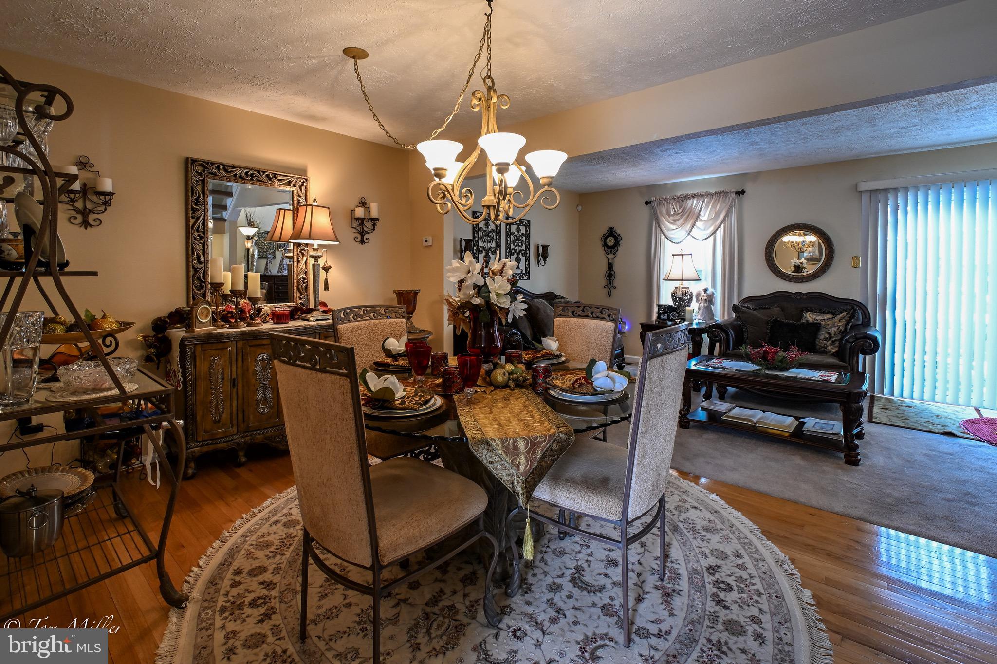 21 Cedarcone Court Nottingham, MD 21236 - Photo 25 of 38 a living room with furniture a clock and a window