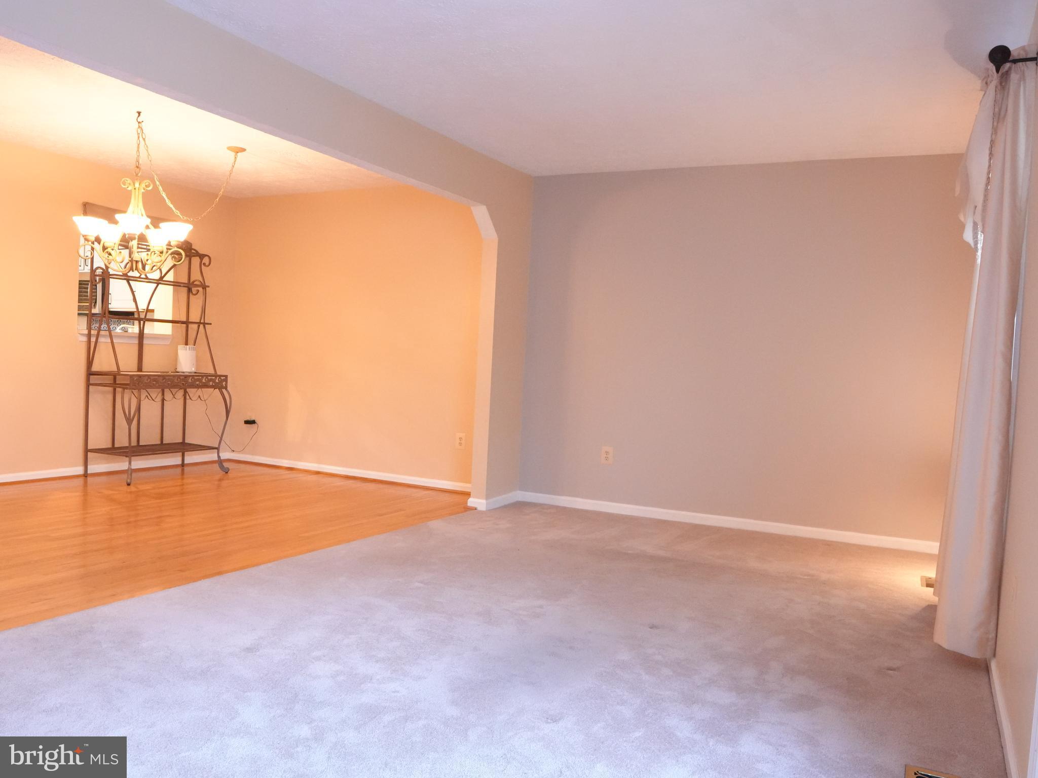 21 Cedarcone Court Nottingham, MD 21236 - Photo 8 of 38 an empty room with windows and ceiling fan