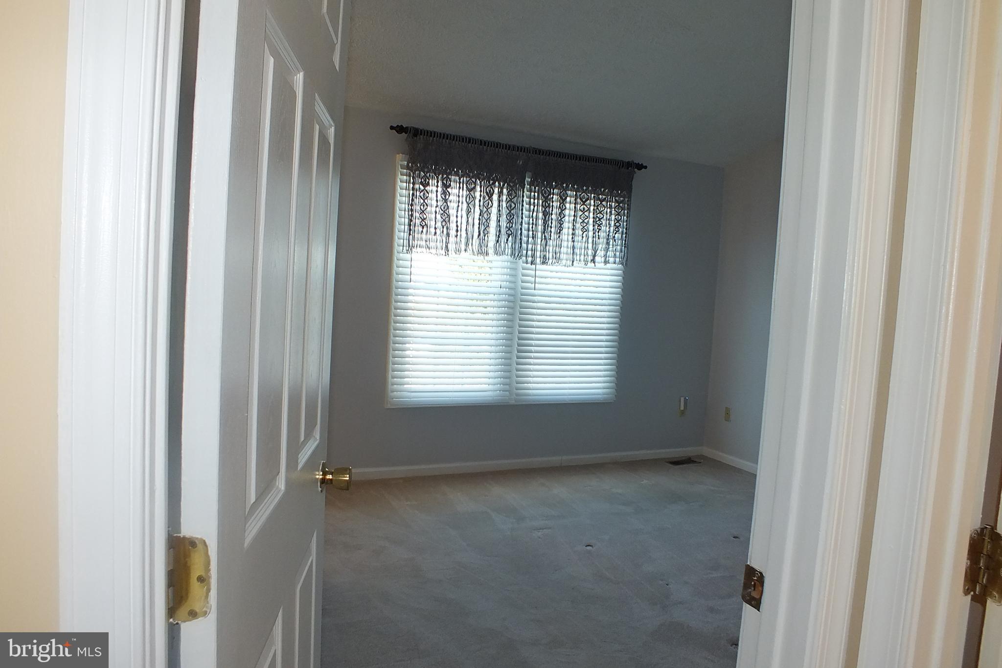 21 Cedarcone Court Nottingham, MD 21236 - Photo 9 of 38 a view of an empty room with a window