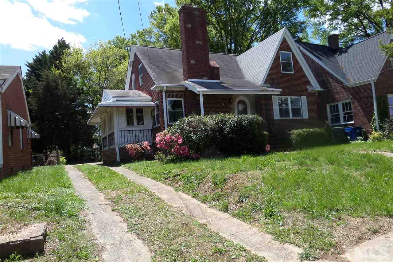 1102 East Martin Street Raleigh, NC 27610 - Photo 2 of 21 a front view of house with yard and green space
