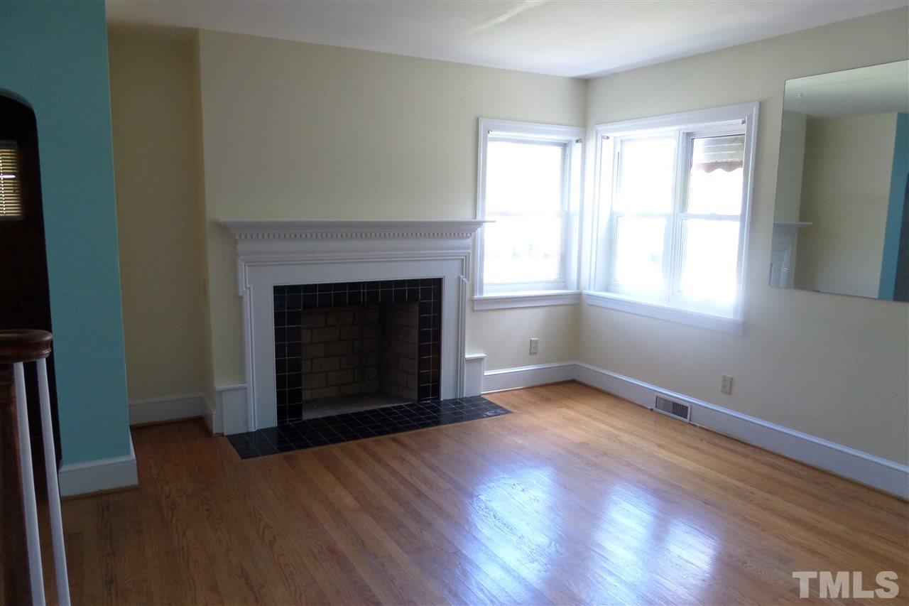 1102 East Martin Street Raleigh, NC 27610 - Photo 7 of 21 an empty room with windows and fireplace