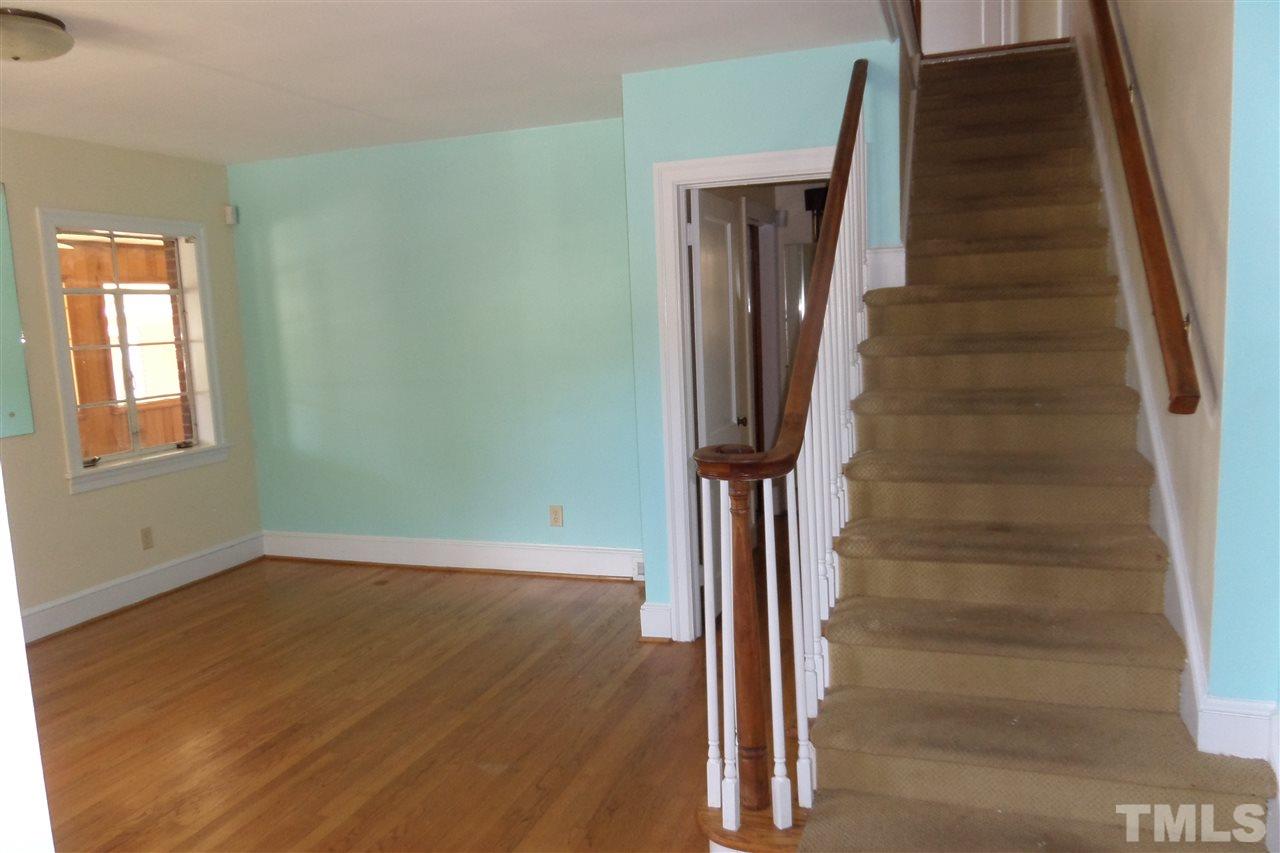 1102 East Martin Street Raleigh, NC 27610 - Photo 9 of 21 a view of entryway with wooden floor and stairs