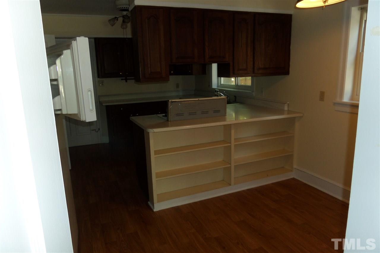 1102 East Martin Street Raleigh, NC 27610 - Photo 10 of 21 a kitchen with a sink and a refrigerator