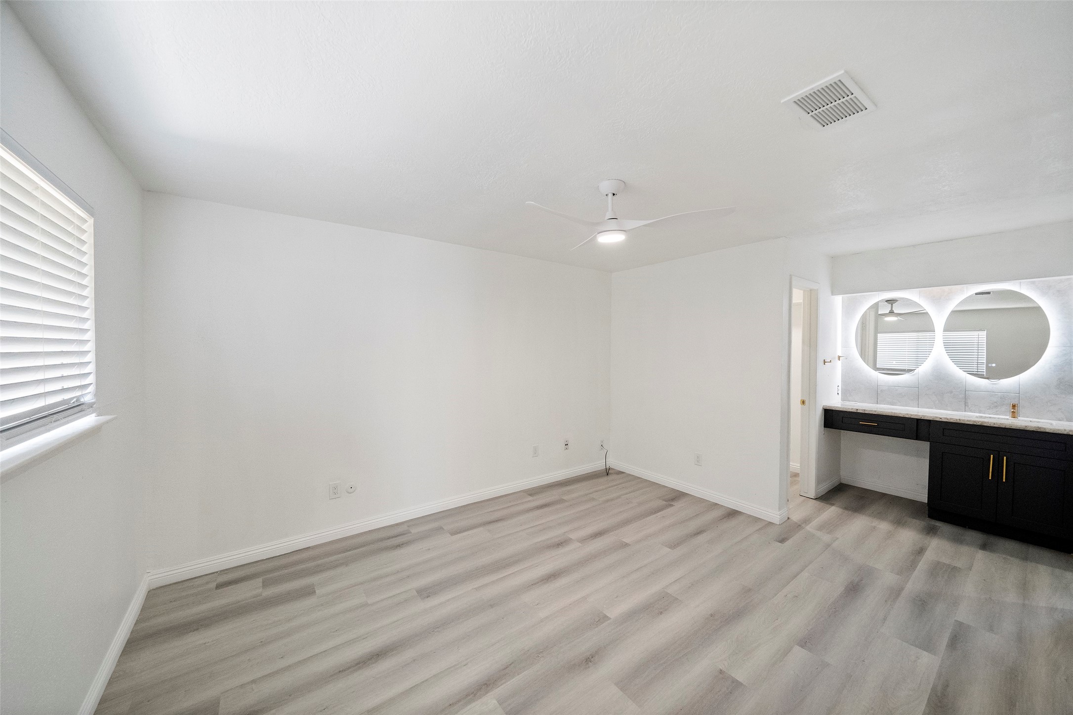 5726 Yorkgate Drive Spring, TX 77373 - Photo 14 of 22 a view of a room with a wooden floor and a sink