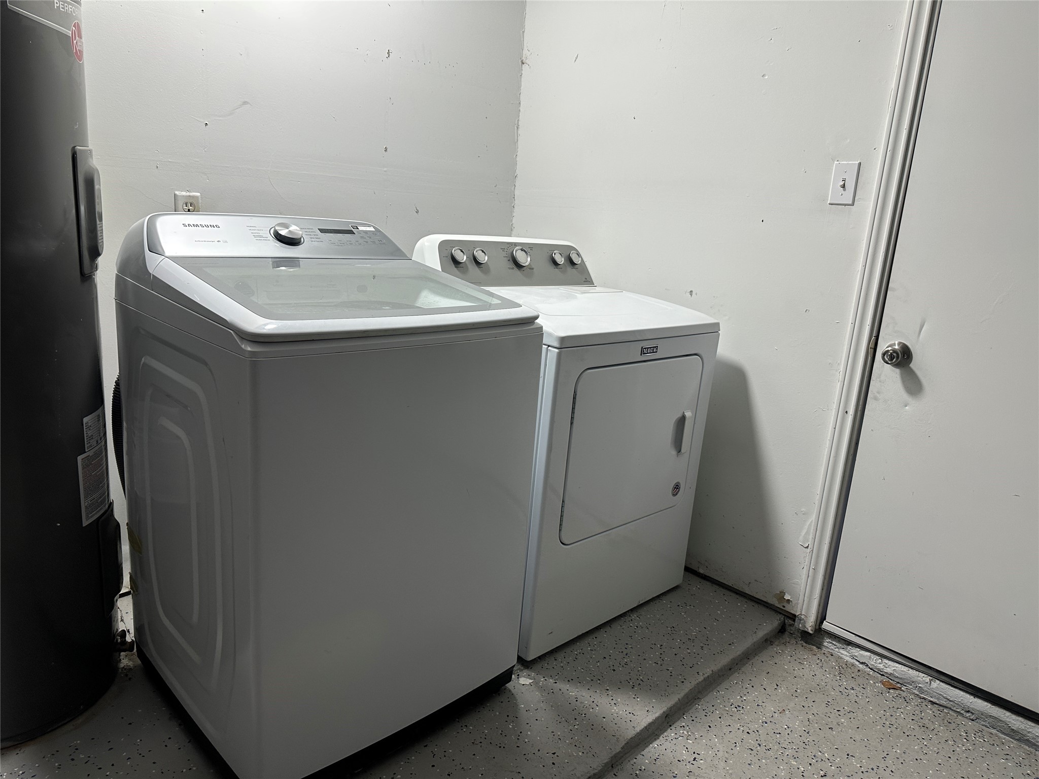 5726 Yorkgate Drive Spring, TX 77373 - Photo 21 of 22 a utility room with dryer and washer