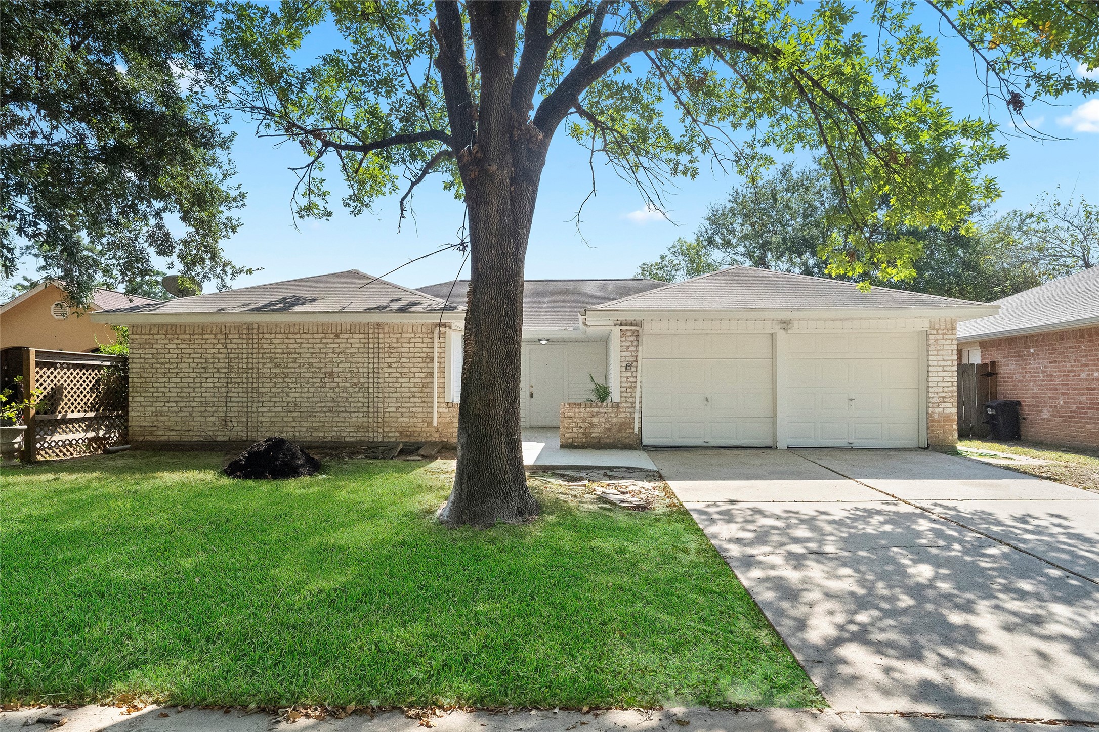 5726 Yorkgate Drive Spring, TX 77373 - Photo 3 of 22 a house that has a tree in front of a white house