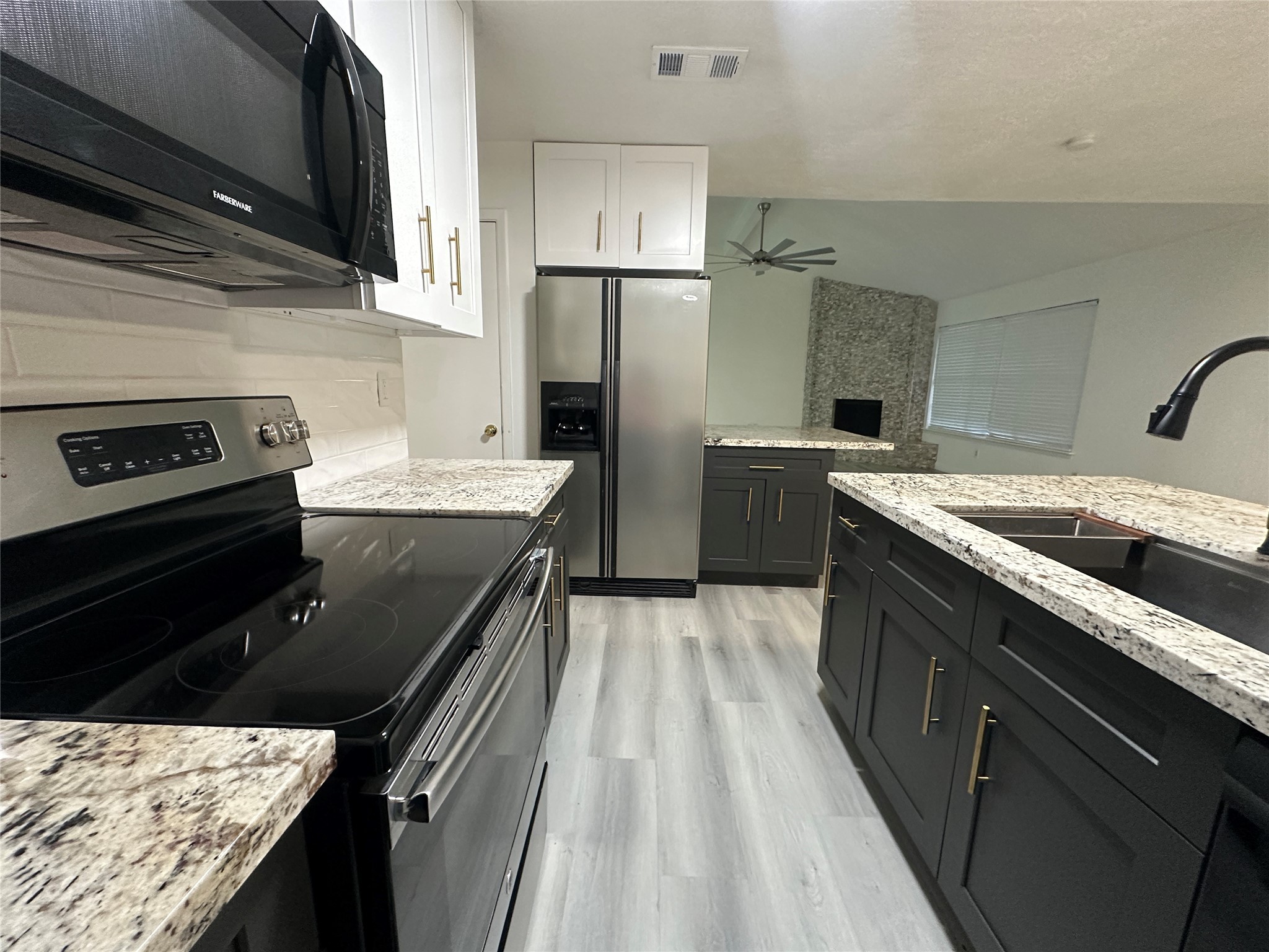 5726 Yorkgate Drive Spring, TX 77373 - Photo 8 of 22 a kitchen with a sink stove and refrigerator
