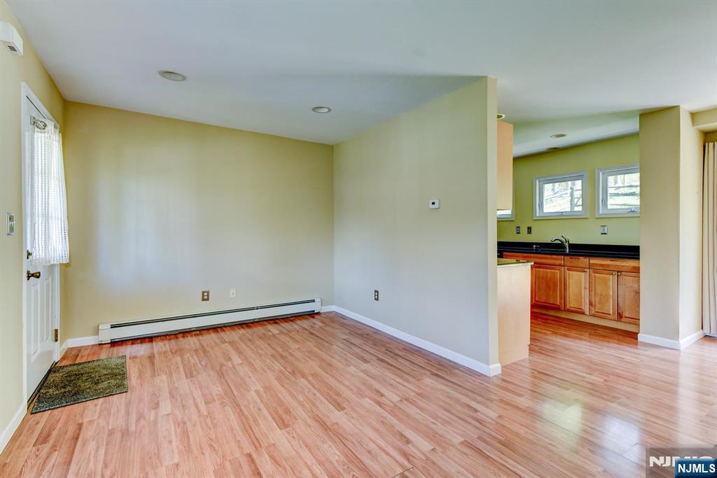 64 Hilltop Trail Sparta, NJ 07871 - Photo 11 of 40 a view of a room with wooden floor and a window