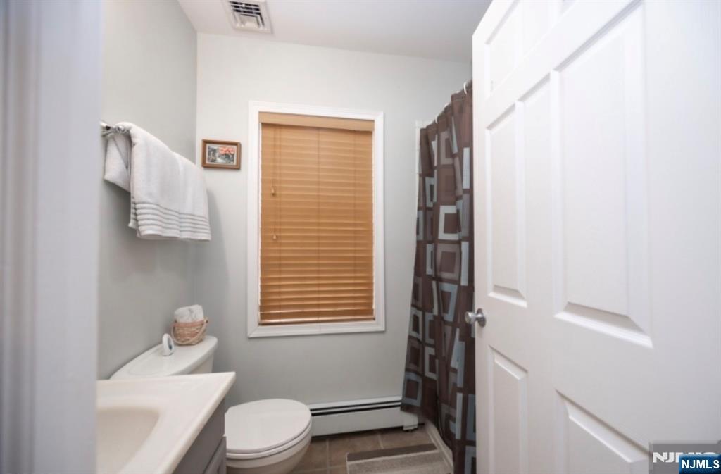 64 Hilltop Trail Sparta, NJ 07871 - Photo 19 of 40 a bathroom with a sink a toilet and shower