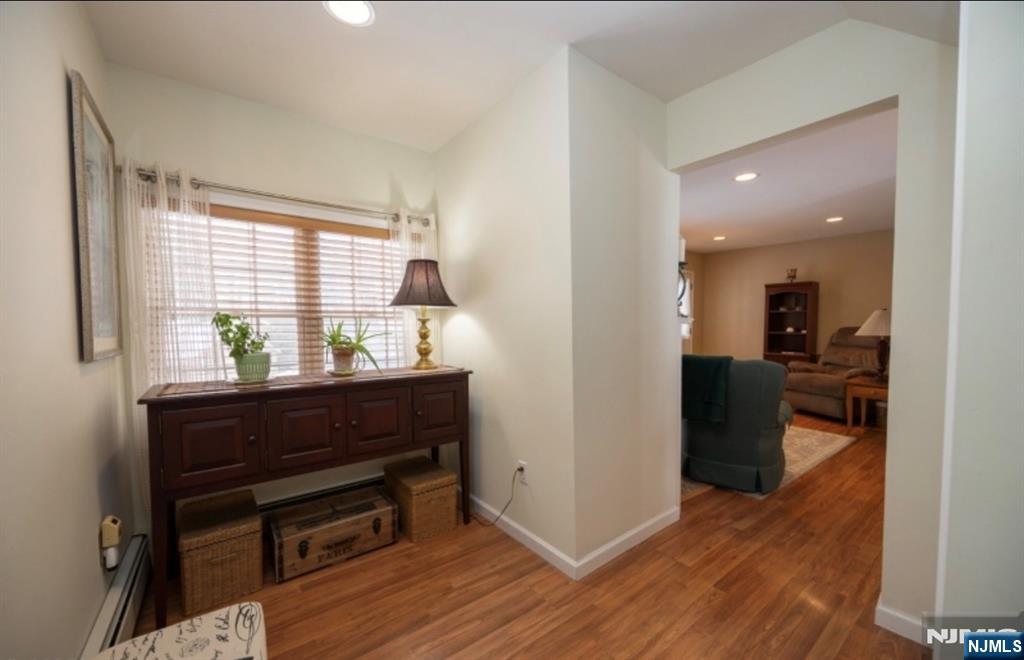 64 Hilltop Trail Sparta, NJ 07871 - Photo 26 of 40 a room with wooden floor and furniture