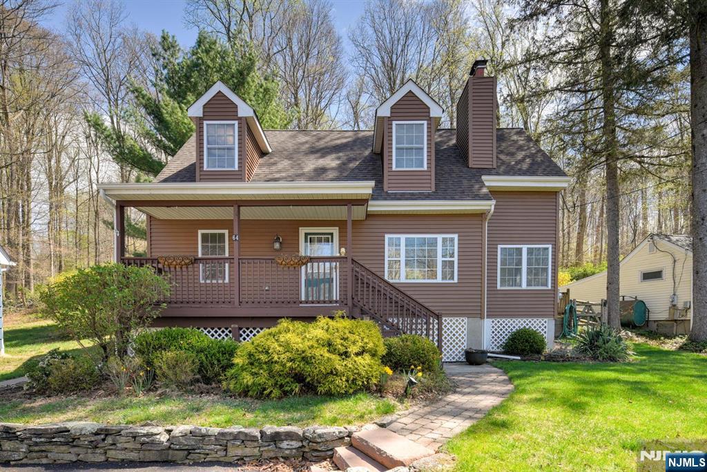 64 Hilltop Trail Sparta, NJ 07871 - Photo 3 of 40 a front view of a house with garden