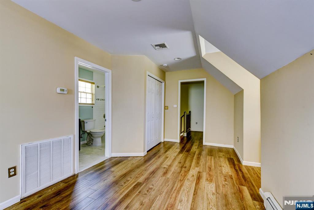 64 Hilltop Trail Sparta, NJ 07871 - Photo 33 of 40 a view of a room with wooden floor and a bathroom