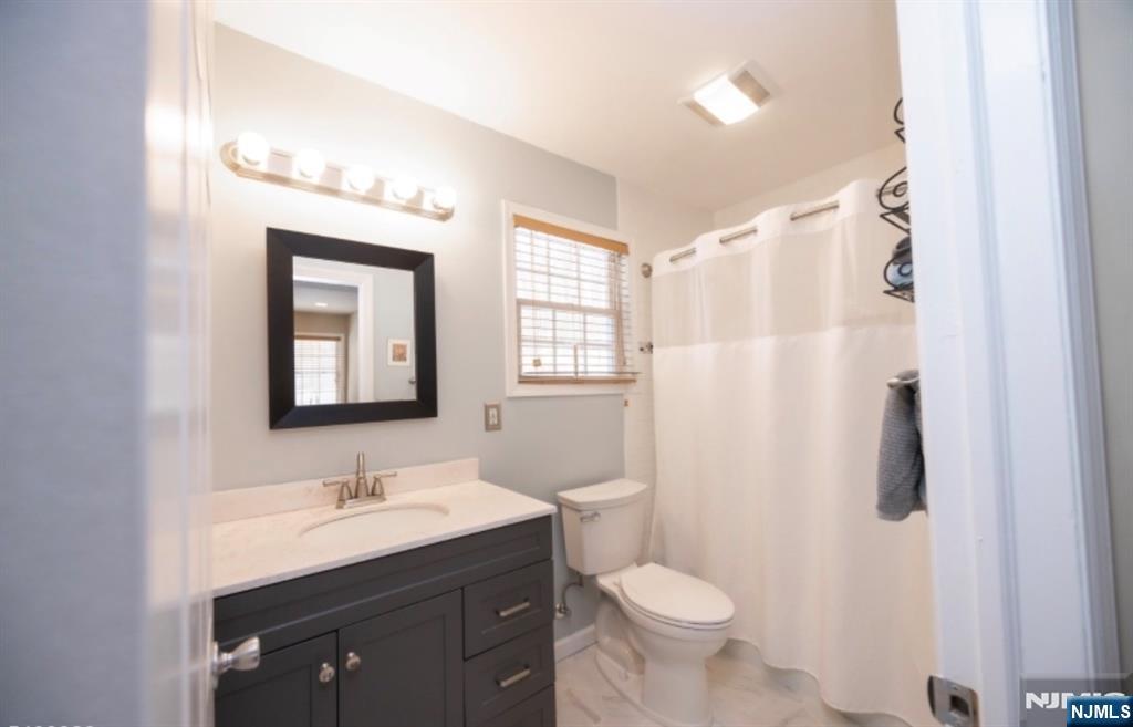 64 Hilltop Trail Sparta, NJ 07871 - Photo 36 of 40 a bathroom with a toilet sink and mirror