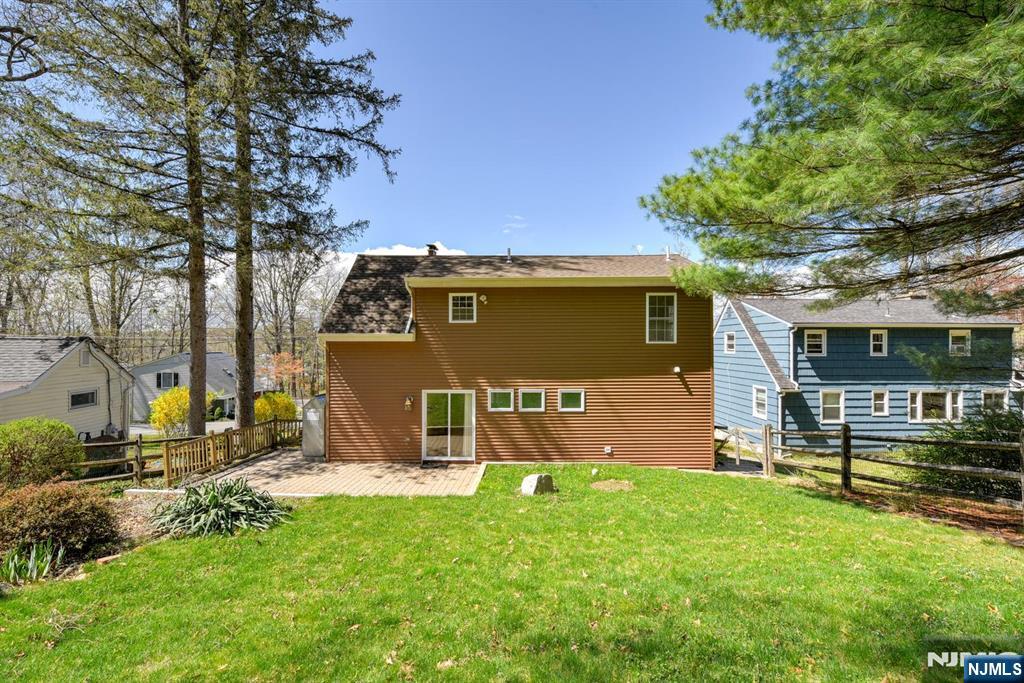 64 Hilltop Trail Sparta, NJ 07871 - Photo 40 of 40 a front view of a house with a garden