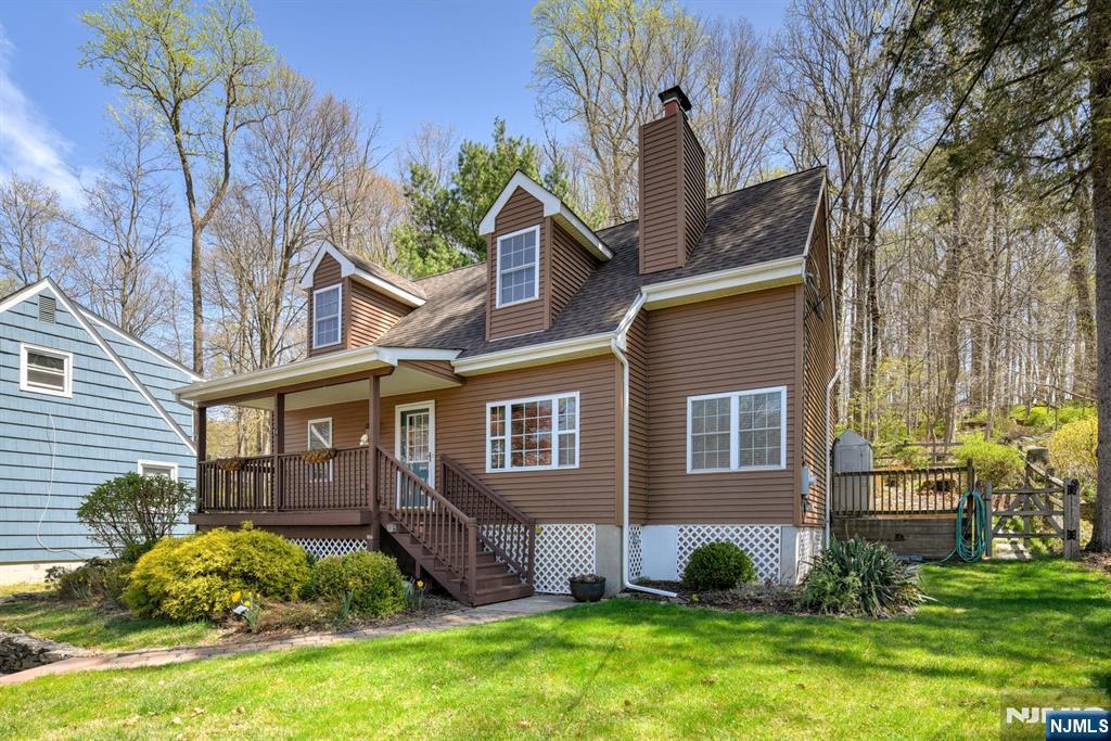 64 Hilltop Trail Sparta, NJ 07871 - Photo 4 of 40 front view of a house with a yard