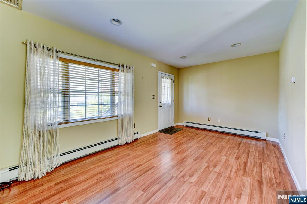 64 Hilltop Trail Sparta, NJ 07871 - Photo 10 of 40 a view of a room with wooden floor and natural light