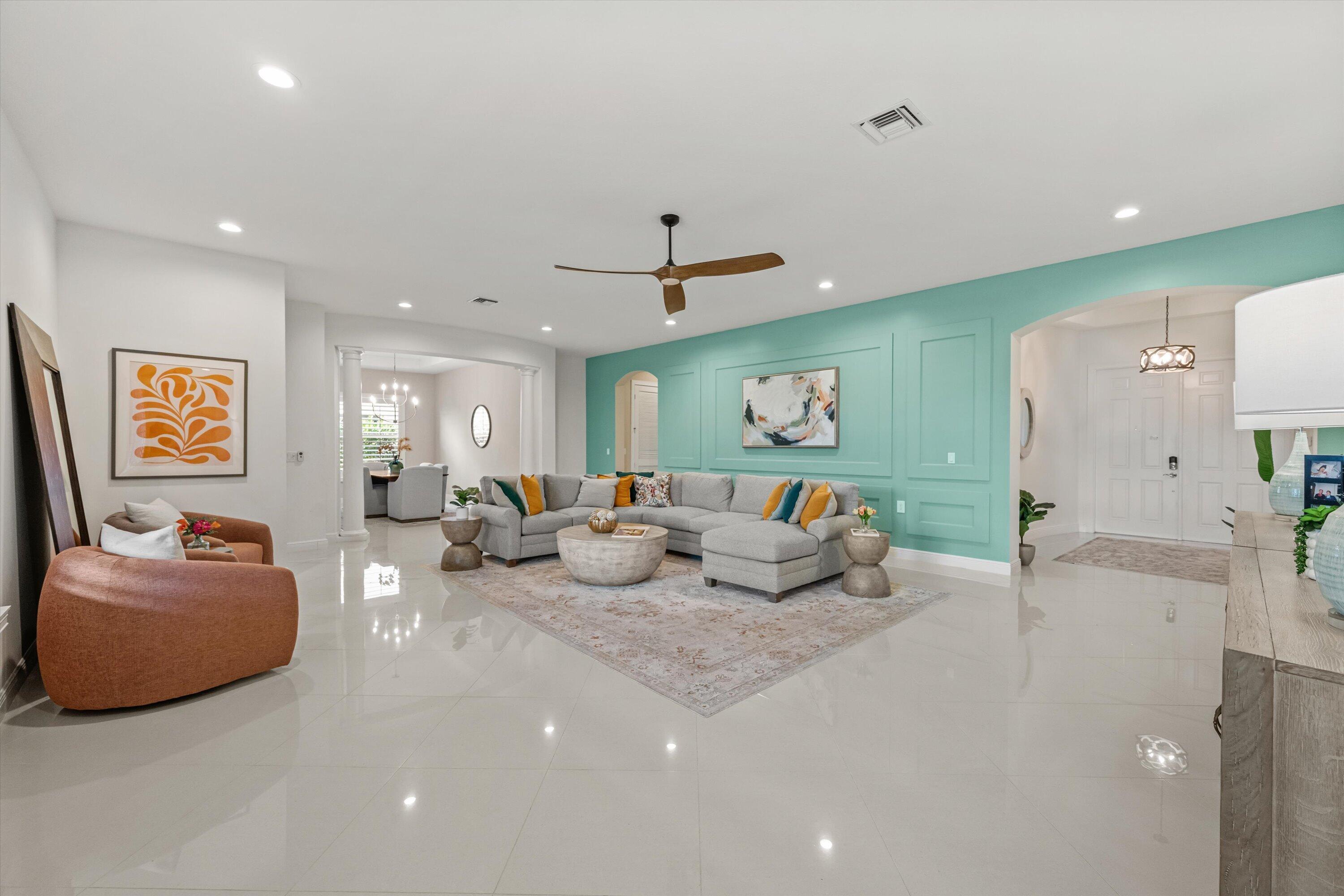 108 Casa Circle Jupiter, FL 33458 - Photo 6 of 53 a living room with furniture and a chandelier