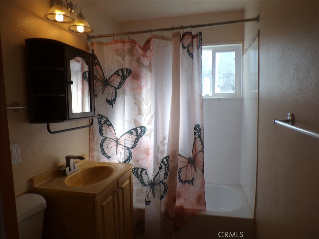 16183 18th Avenue Clearlake, CA 95422 - Photo 12 of 21 a bathroom with a sink and mirror