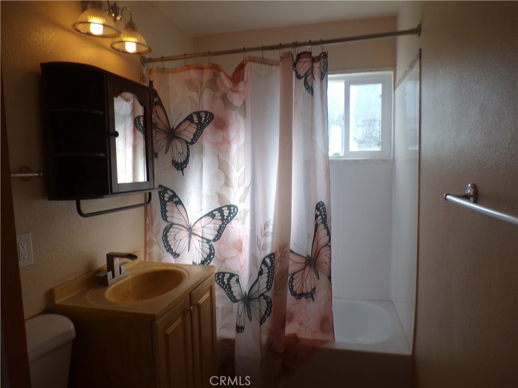 16183 18th Avenue Clearlake, CA 95422 - Photo 13 of 21 a bathroom with a sink and mirror