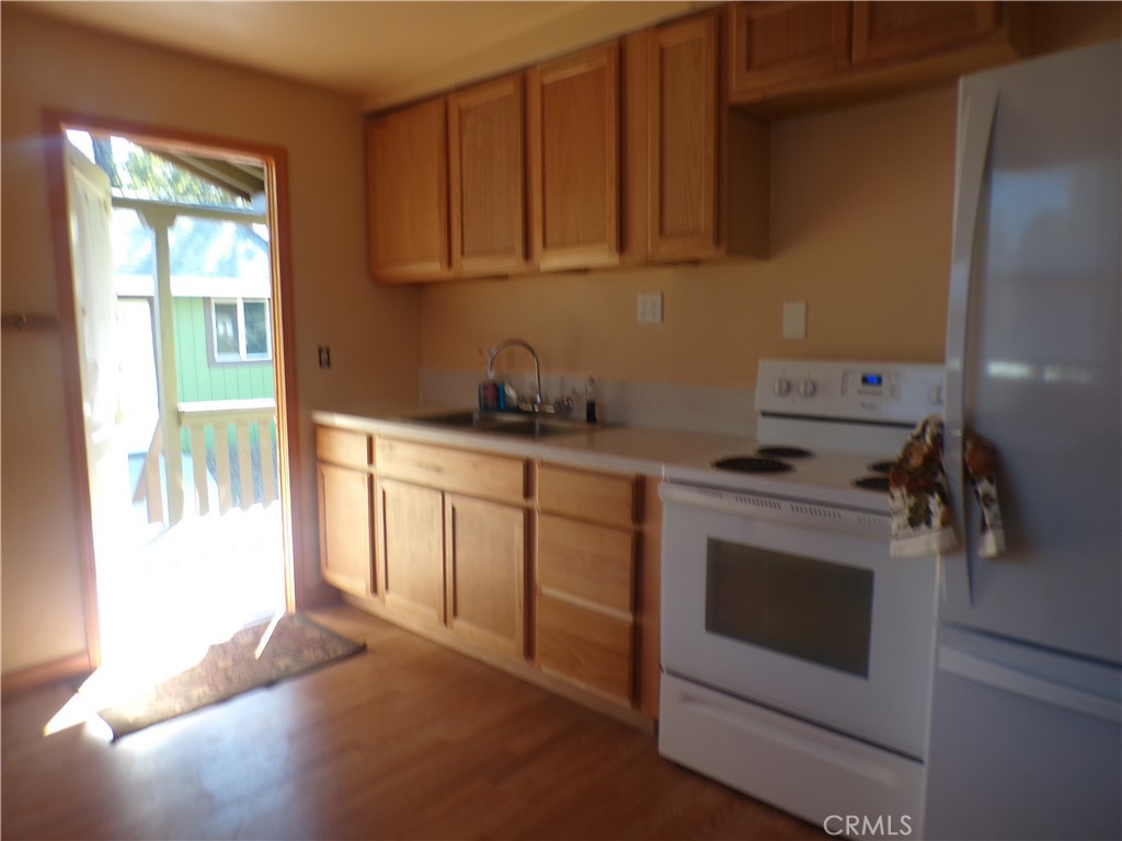 16183 18th Avenue Clearlake, CA 95422 - Photo 15 of 21 a kitchen with a stove and a sink