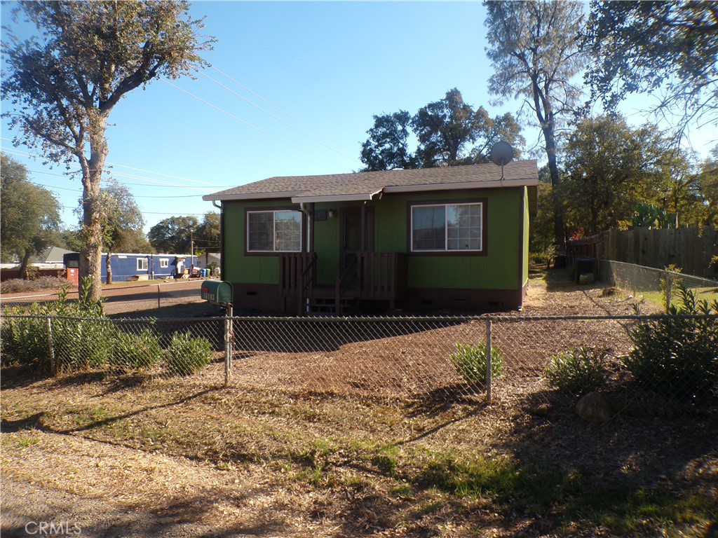 16183 18th Avenue Clearlake, CA 95422 - Photo 2 of 21 a front view of a house with a yard