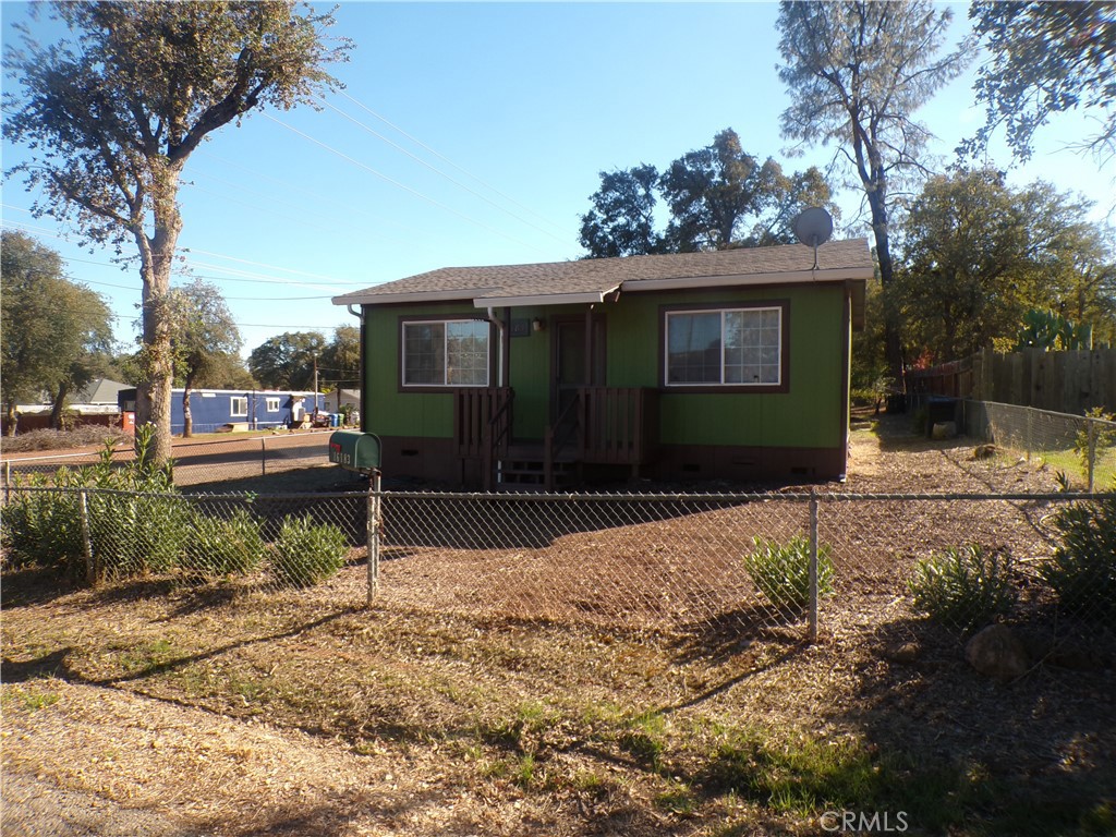16183 18th Avenue Clearlake, CA 95422 - Photo 3 of 21 a front view of a house with a yard covered with snow