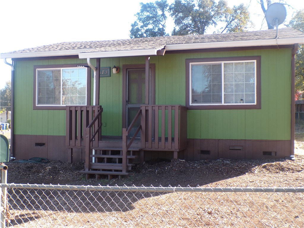 16183 18th Avenue Clearlake, CA 95422 - Photo 5 of 21 a view of a house with a yard and wooden fence