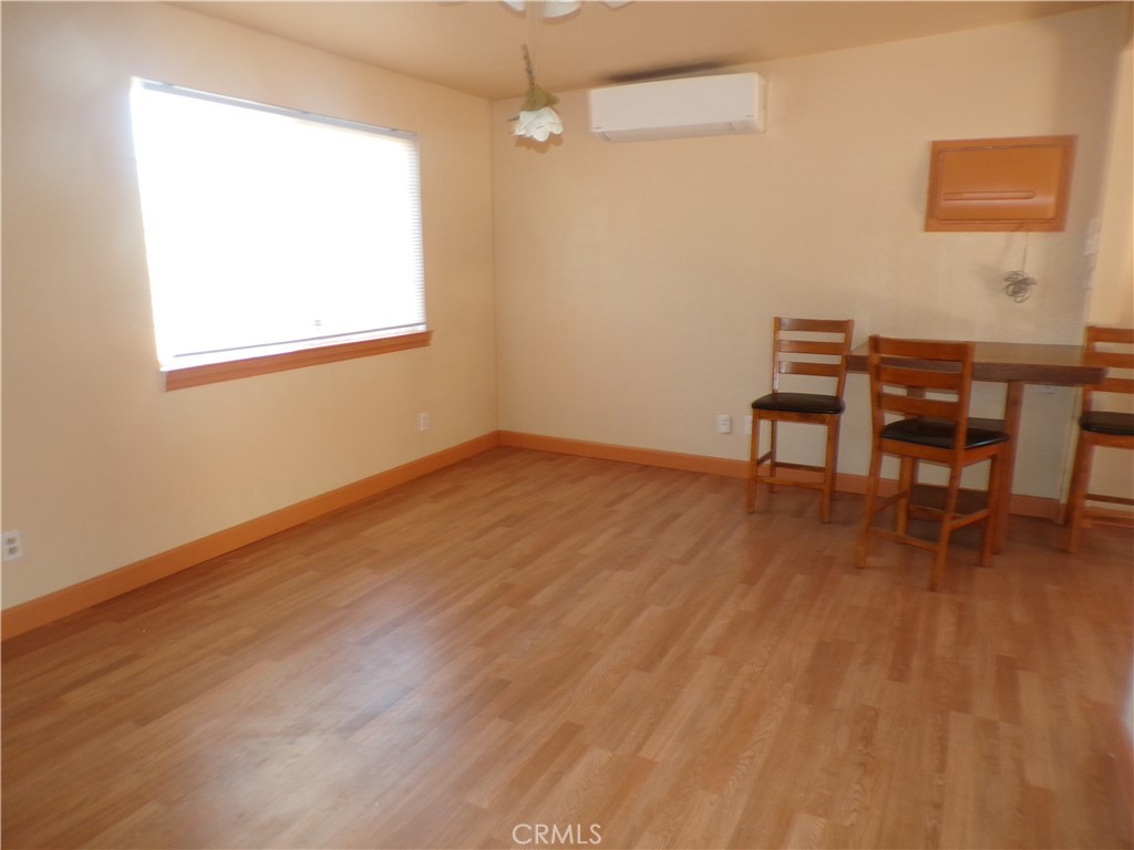 16183 18th Avenue Clearlake, CA 95422 - Photo 10 of 21 a workspace room with wooden floor table and chair