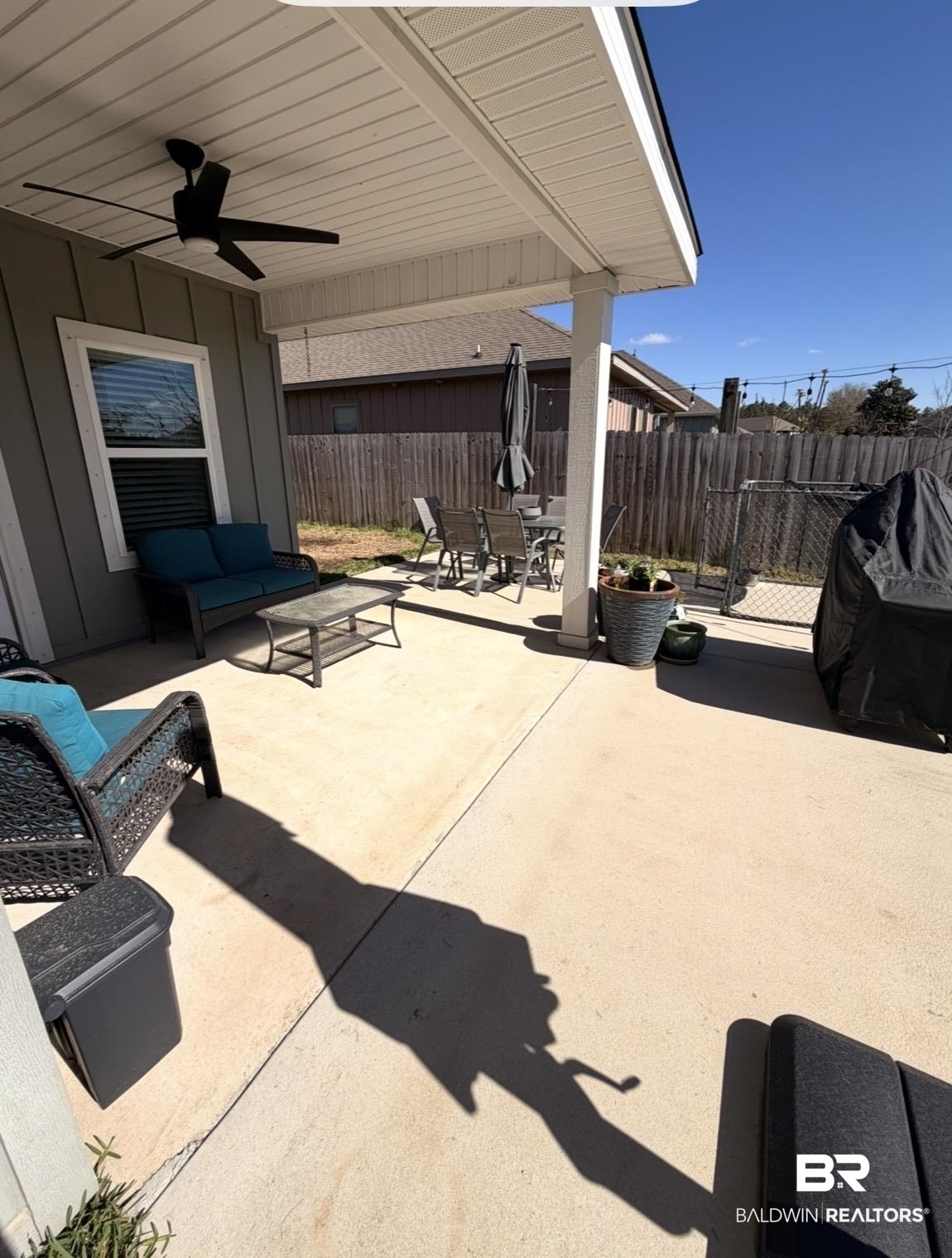 32215 Calder Court Daphne, AL 36527 - Photo 11 of 13 Fenced backyard featuring ceiling fan, a patio area, and outdoor dining area