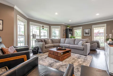 a living room with furniture and windows